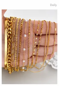Close-up of assorted 18K gold plated stainless steel chains held in hand for detail