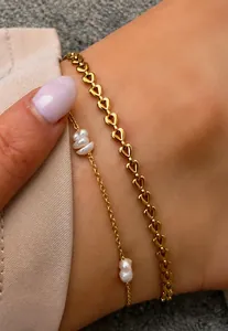 Close-up of 18K gold plated heart link anklet with baroque pearl chain detail