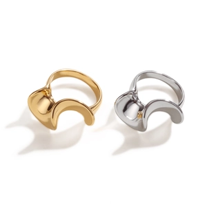 Modern 18k gold and silver plated stainless steel S-shape wave rings on white background