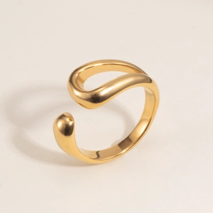 Macro shot of polished 18K gold-plated irregular minimalist ring with fluid design