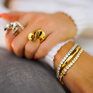 Exaggerated S-shaped 18k gold plated stainless steel ring with stacked tennis bracelets