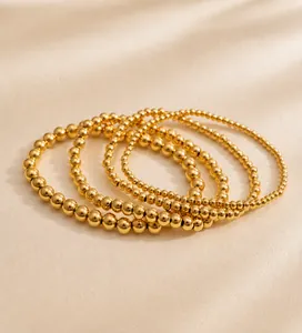 Set aus fünf polierten, 18 Karat vergoldeten Edelstahl-Perlenarmbändern für Damen
