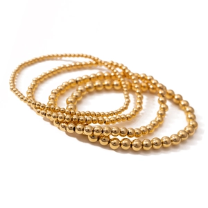 Set aus fünf 18K vergoldeten Edelstahlperlen-Armbändern mit einer glänzend polierten Oberfläche