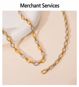 Macro detail of two-tone gold and silver chain necklace with polished oval links