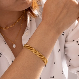 Bracciale a maglia intrecciata in acciaio al titanio placcato oro 18 carati