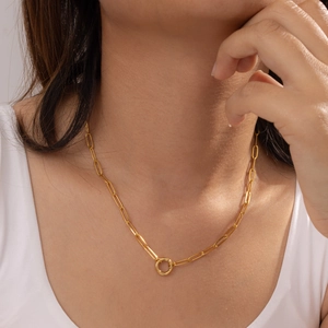 Detail of 18K gold plated paperclip chain necklace with a round spring clasp closure