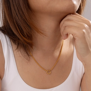 Minimalist 18K gold plated stainless steel necklace with circle pendant on female model
