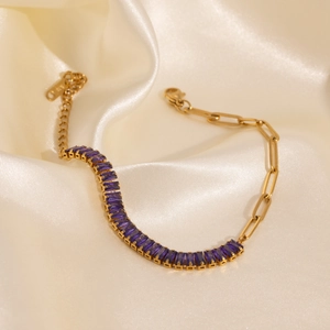 Close-up of 18k gold-plated bracelet with purple zircon stones and K18 engraving detail