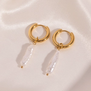 Macro detail of 18K gold plated hoop earrings featuring elegant baroque pearl pendants