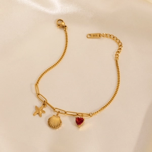 18k gold plated stainless steel bracelet with starfish, seashell, and red heart charms