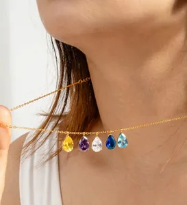 Close-up of five pear-cut multicolor zircon drop pendants on 18k gold plated chain