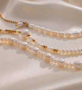 Macro shot of 18K gold plated beads and natural freshwater pearls on the bracelet detail