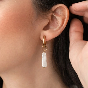 Elegant 18K gold plated hoop earrings with baroque pearl pendants on female model