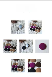Macro detail of various colored fabric covered round buttons for suits and coats
