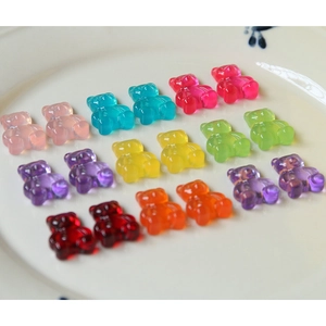 Close-up of colorful translucent resin gummy bears on a ceramic plate for DIY crafts
