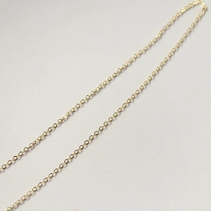 Macro shot of minimalist gold-plated O-chain links for DIY necklace and bracelet crafting