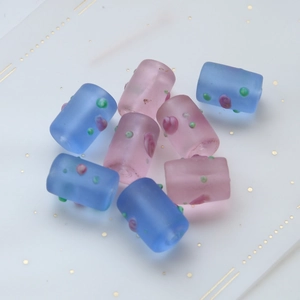 Frosted cylindrical glass beads with colorful embossed polka dots for DIY jewelry