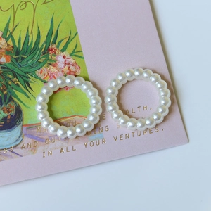Elegant set of two faux pearl beaded rings with soft milky white luster in French retro style