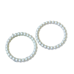 Pair of elegant white resin pearl elastic bracelets in a minimalist circular design