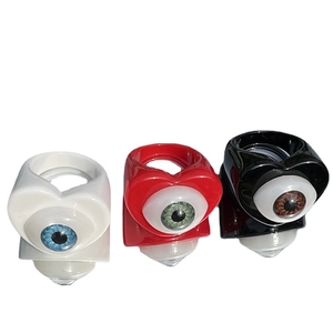 Creative heart-shaped eye rings in white, red, and black resin with polished finish