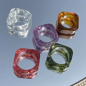 Translucent ink-wash square resin rings in five elegant colors on reflective mirror