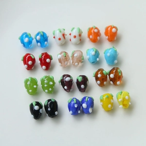 Colorful strawberry-shaped glass beads with polka dots for DIY jewelry making