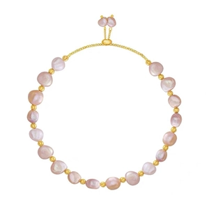Baroque pearl bracelet with gold beads and adjustable drawstring clasp on white background