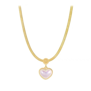 Vintage gold snake chain necklace with heart pendant and Love engraving on white background