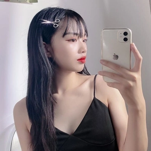 Sparkling rhinestone scissor hair clip accessory for women shown in a stylish side-hair pose