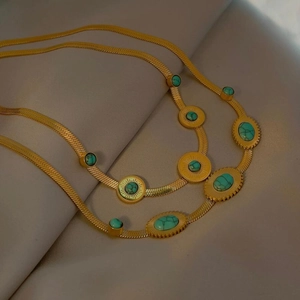 Vintage gold layered snake chain necklace with turquoise pendants and bohemian style