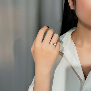 Elegant rose gold titanium ring with shell inlay and zircon worn on finger