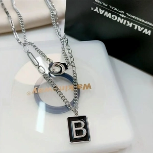 Double layered silver stainless steel necklace featuring letter B pendant and interlocking rings