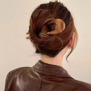 Elegant U-shaped hair fork in brown tortoiseshell acetate for minimalist hair styling