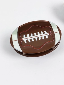 Rugby-shaped hair claw clip in brown finish with white stitch design for women