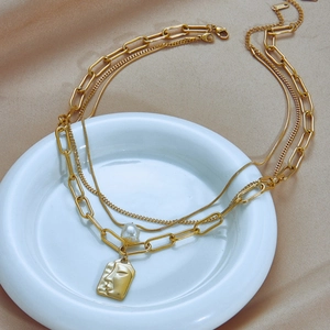 Three-layer gold titanium steel necklace with square face pendant and pearl accent