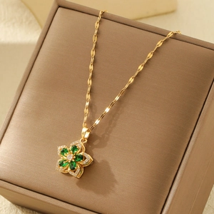 Golden flower pendant necklace with green emerald zircon and sparkling crystals