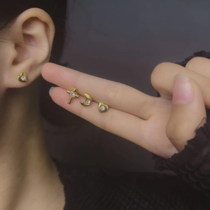 Gold titanium steel screw-back earrings set with heart, moon, and star zircon studs