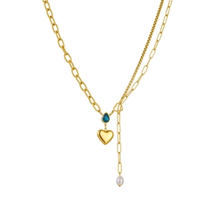 Gold layering necklace featuring blue teardrop crystal, heart charm, and pearl pendant