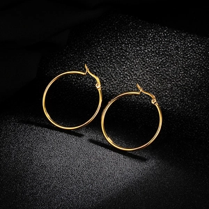 Polished gold plated titanium steel hoop earrings featuring a secure snap closure for women