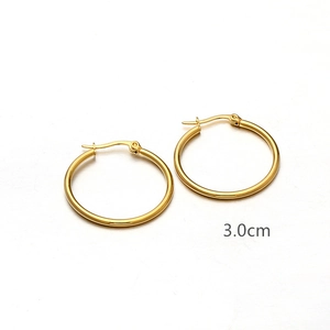 Detailed view of 3.0cm polished gold-plated titanium steel hoop earrings on white background