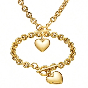 Parure de bijoux en titane doré avec pendentif cœur et fermoir à bascule OT