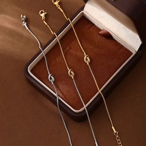 Minimalist stainless steel knot snake chain bracelets in gold and silver finish