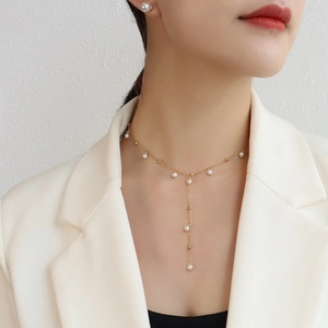 Élégant collier en perles en Y doré pour femme au design minimaliste de style français