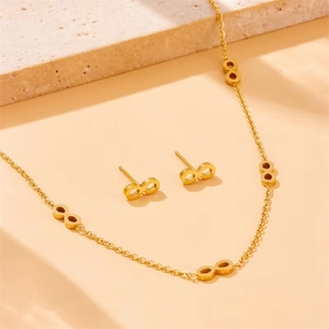 Gold-plated stainless steel jewelry set with infinity symbol necklace and stud earrings