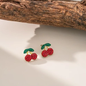 Sparkling red cherry stud earrings with green crystal leaves in gold finish