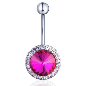 Macro detail of navel ring with rose red gem and clear zircon pavé in silver metal