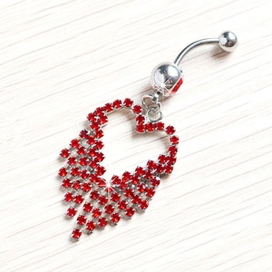 Silver belly button ring with red rhinestone heart pendant and tassel details