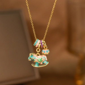 Gold rocking horse pendant necklace with colorful enamel rings and dreamlike carousel charm