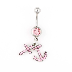Detail of silver belly ring featuring pink rhinestones with cross and anchor charms