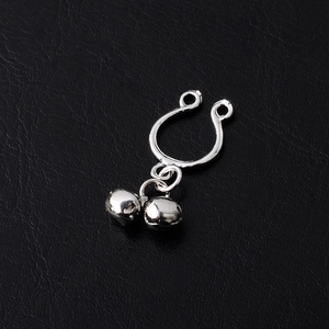 Polished silver non-pierced nipple ring with double bells on a black leather background